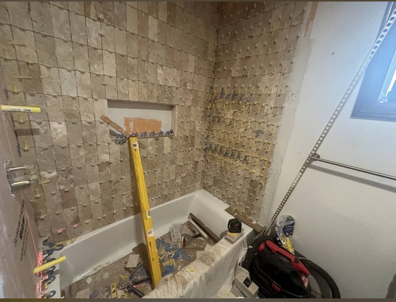 Stone tile installation in progress.