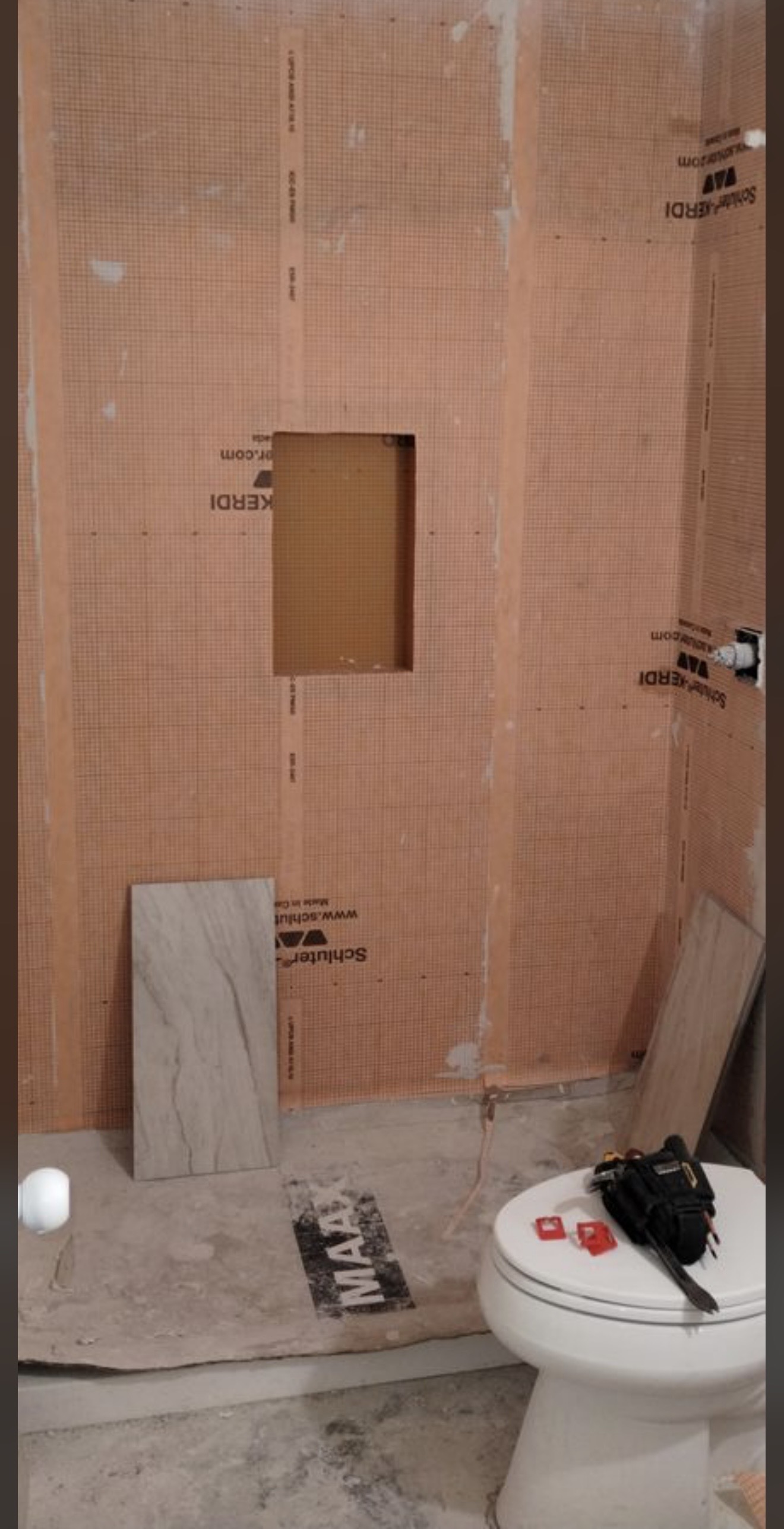 Schluter Kerdi waterproofing in progress.